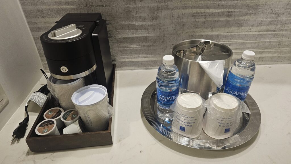 a tray of coffee and water bottles