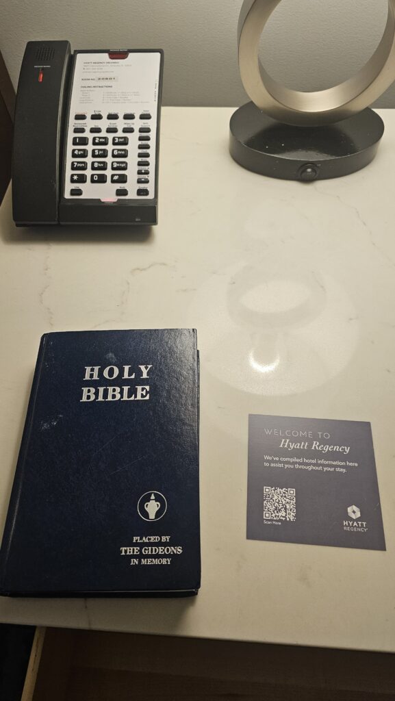 a phone and a book on a table