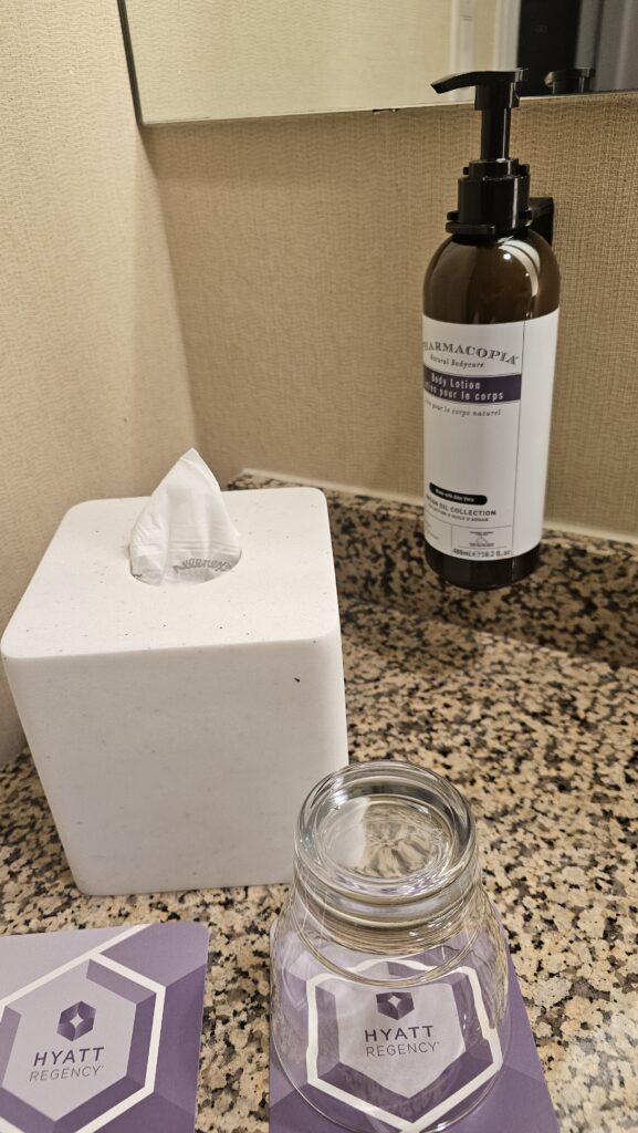 a tissue box and a bottle of liquid