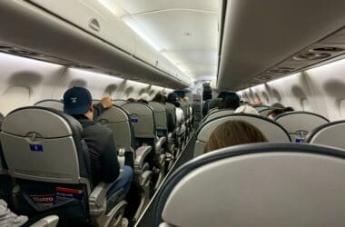 a group of people sitting in United Embraer 170 Economy Class