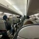 a group of people sitting in United Embraer 170 Economy Class