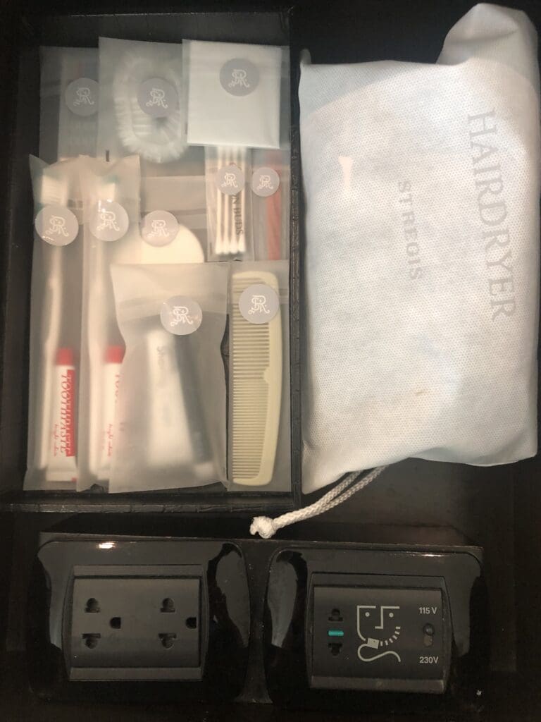 a small box with a bag and a small toothbrush