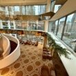 a large room with a staircase and a large window at the Residence Inn by Marriott