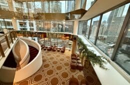 a large room with a staircase and a large window at the Residence Inn by Marriott