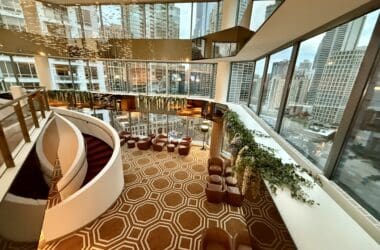 a large room with a staircase and a large window at the Residence Inn by Marriott