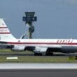 a white airplane on a runway