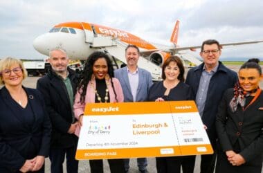 a group of people standing in front of an airplane