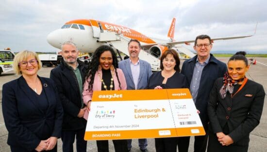 a group of people standing in front of an airplane