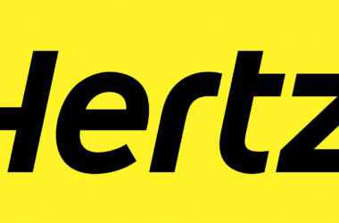 a yellow sign with black letters