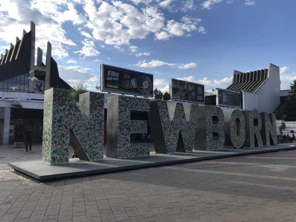 a large sign in the middle of a street