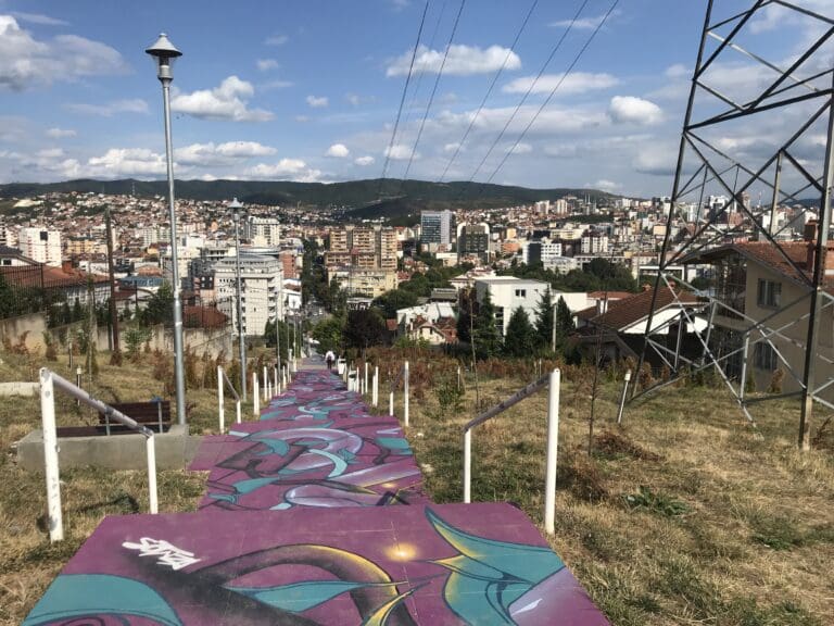 a stairway with a colorful carpet on it