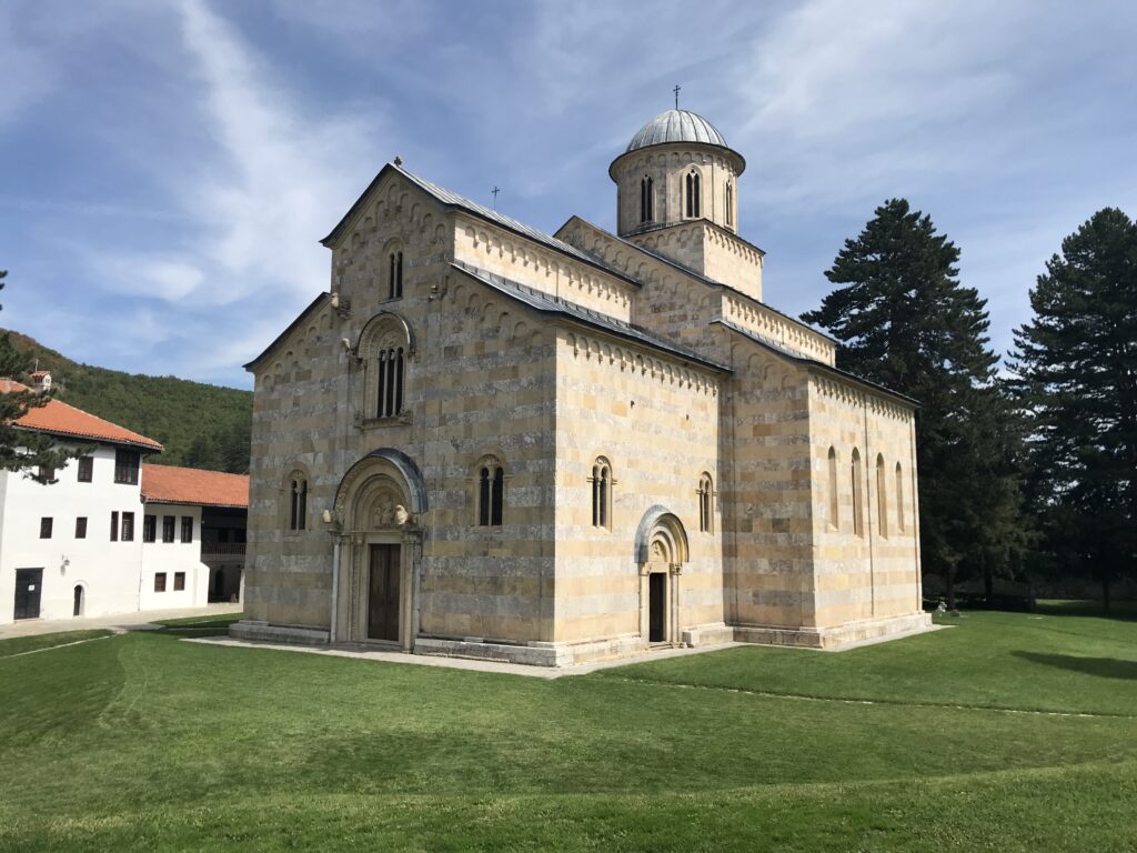 a stone building with a dome on the side