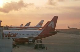 a group of airplanes parked on a runway