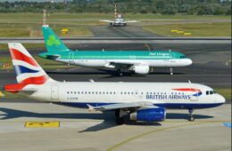 a group of airplanes on a runway