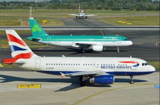 a group of airplanes on a runway