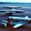 a group of airplanes on a runway