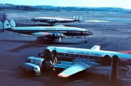 a group of airplanes on a runway