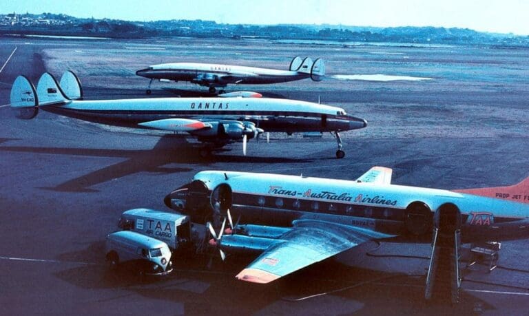 a group of airplanes on a runway