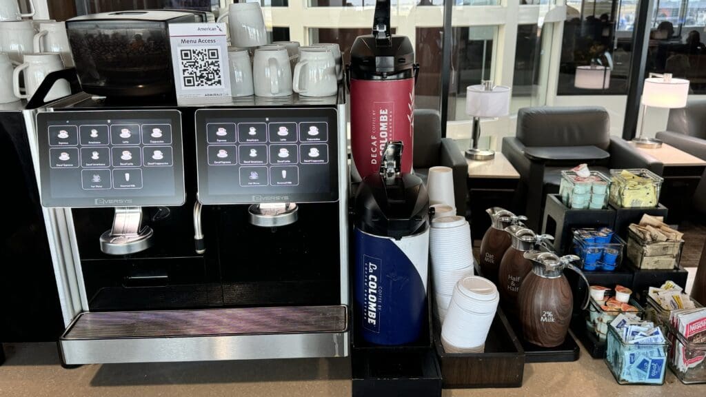 a coffee machine and cups on a counter