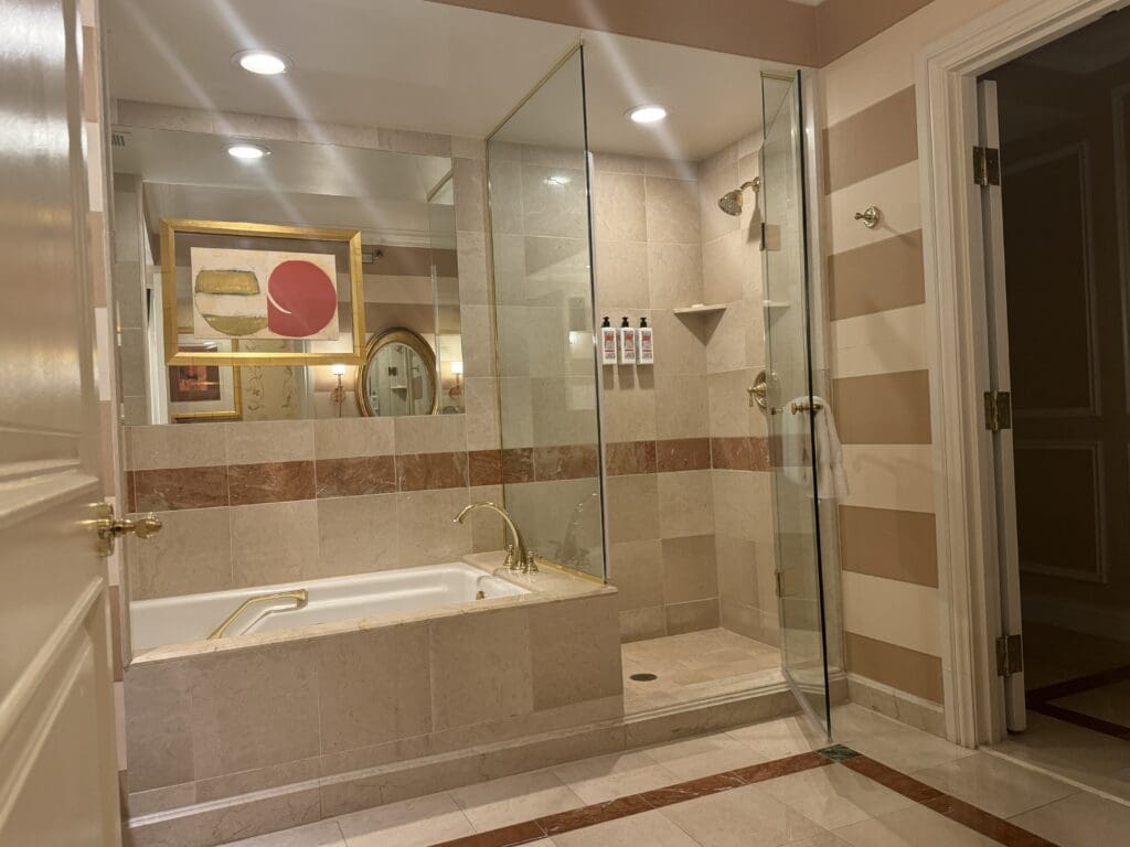 a bathroom with a tub and shower