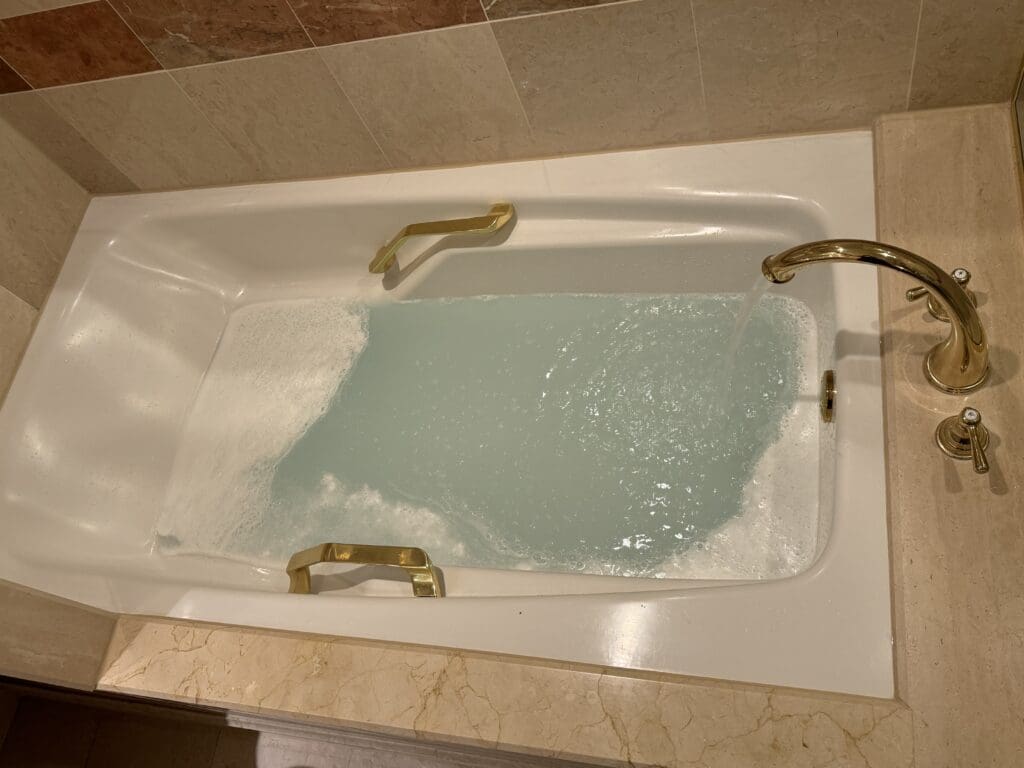 a bathtub with water running out of it