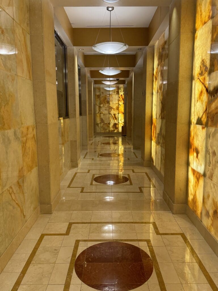 a hallway with lights on the walls