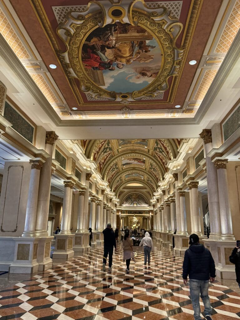 a group of people walking in a hallway