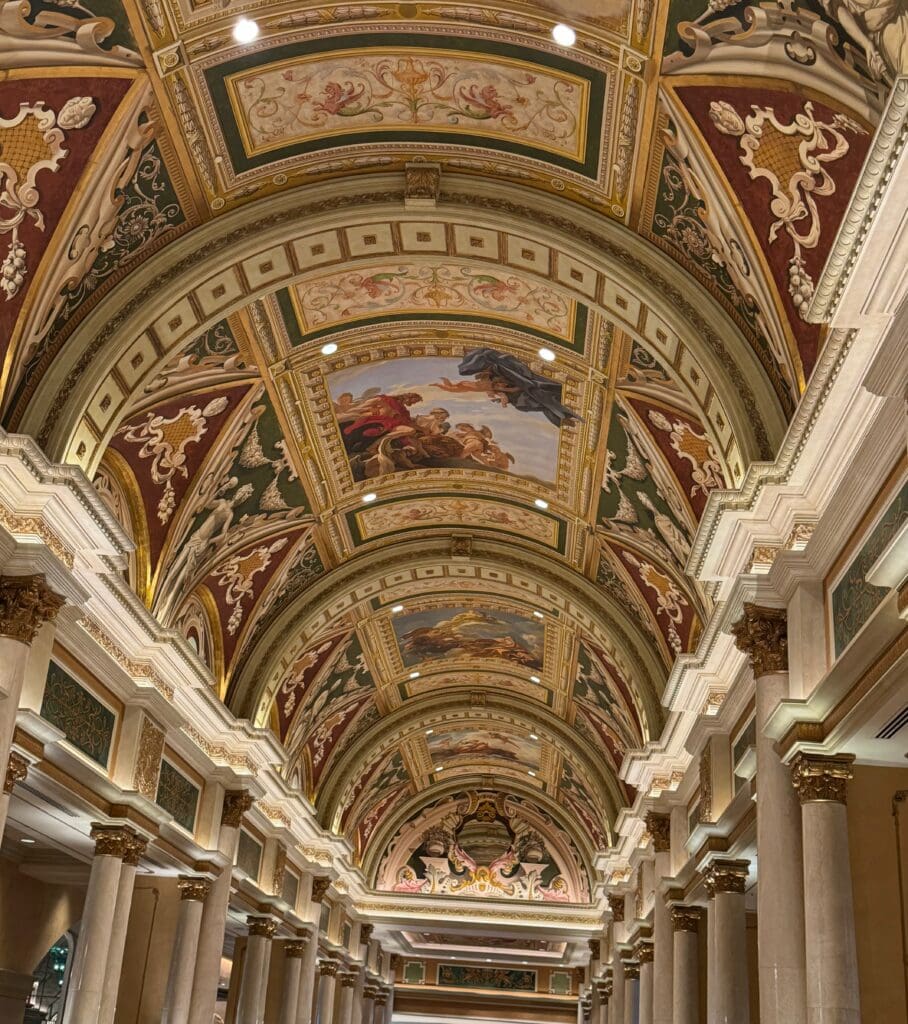 a ceiling of a building with painted ceilings