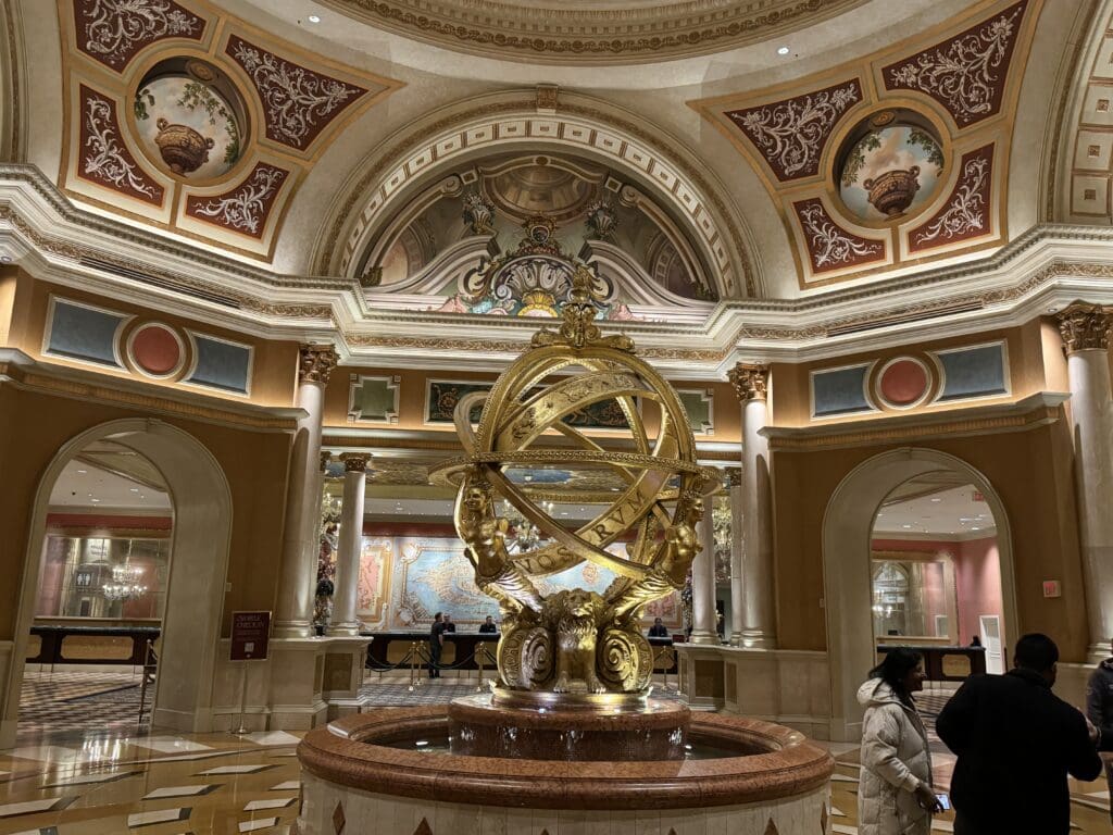 a large gold sculpture in a large room