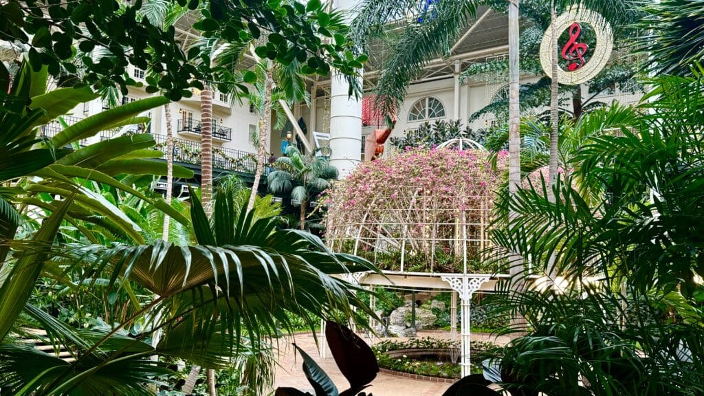 a building with a balcony and trees