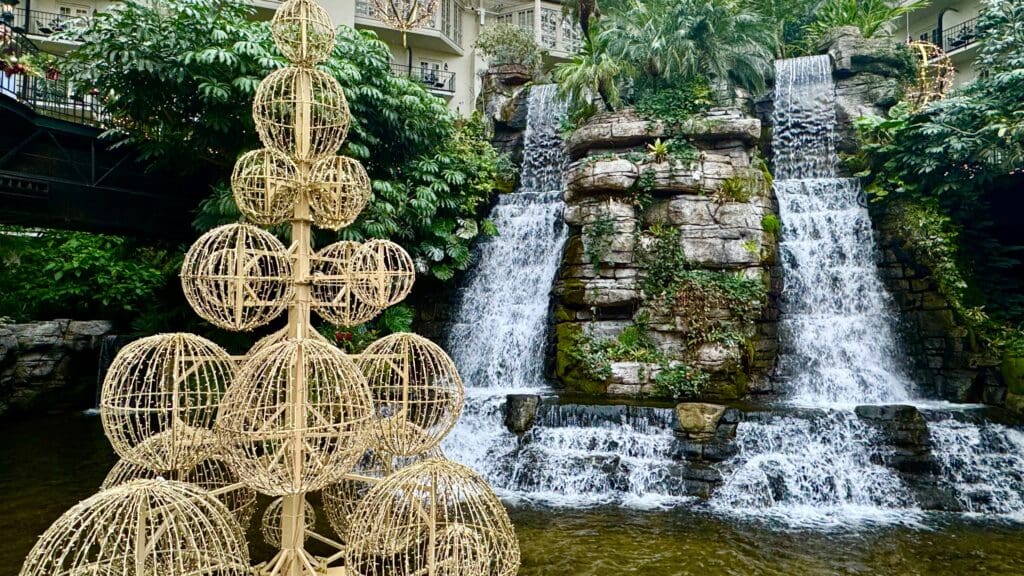 a waterfall with a waterfall in the background