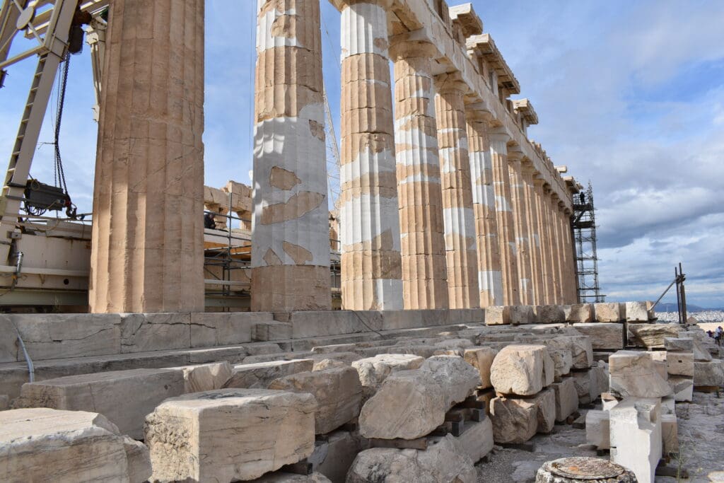 a group of pillars with white and brown stripes