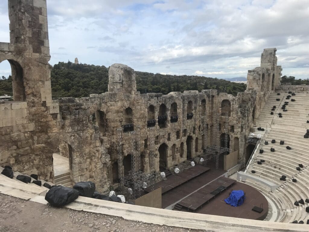 an old stone building with a stage and stairs