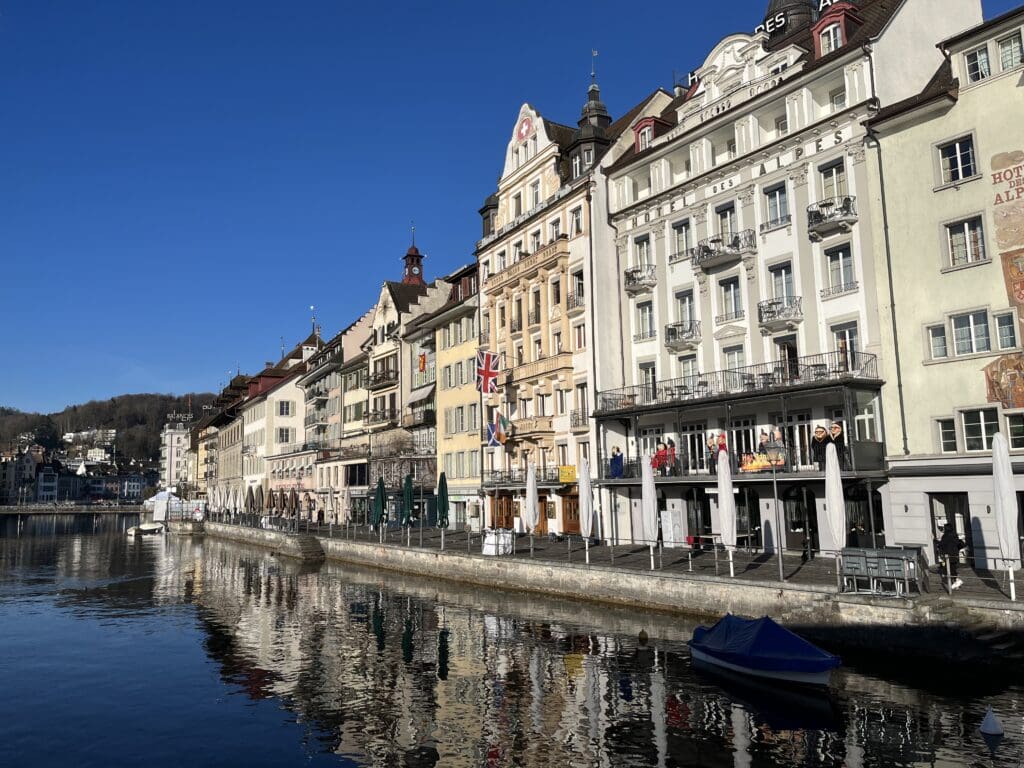 a row of buildings next to a body of water