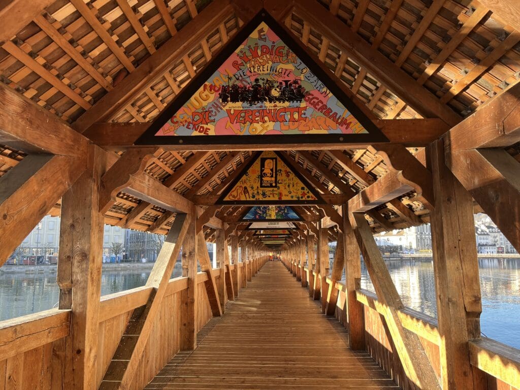 a wooden walkway with triangular signs