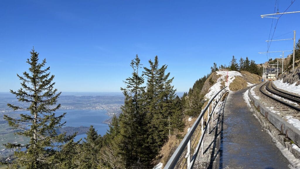 a road with railings on a mountain