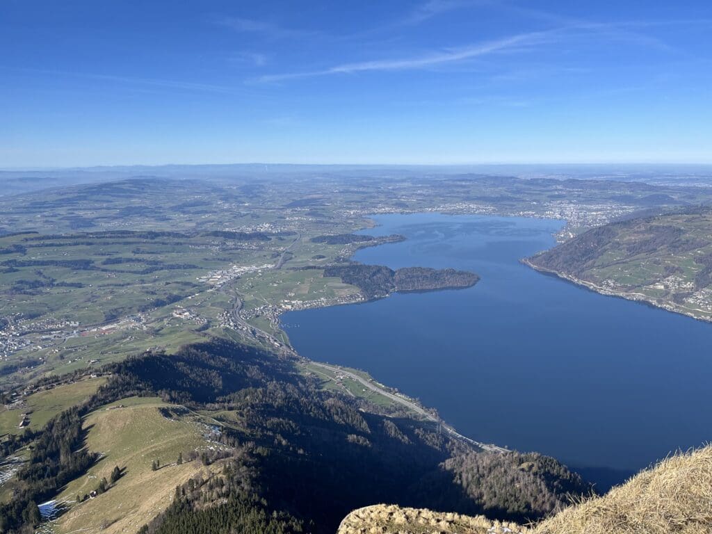 a view of a lake and a city from a mountain