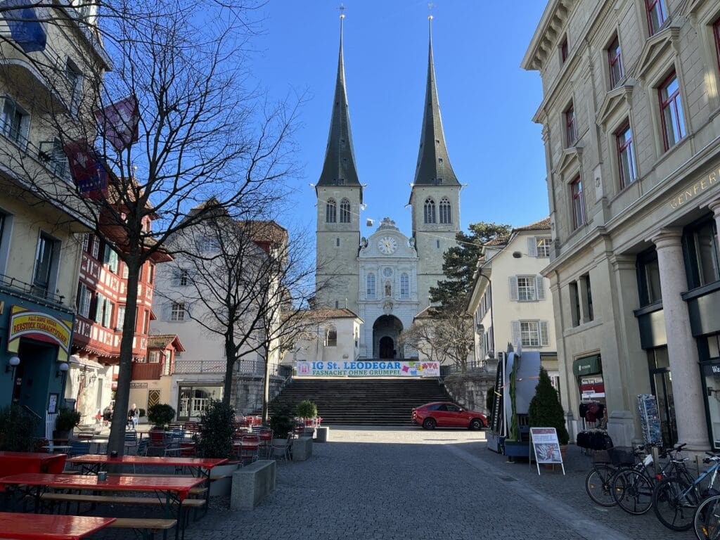 a building with two spires and a clock on the top