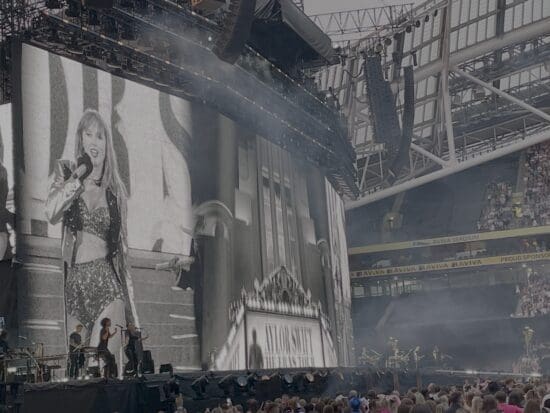 a large screen with a large picture of a woman on it