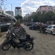 a group of parked motorcycles on a sidewalk