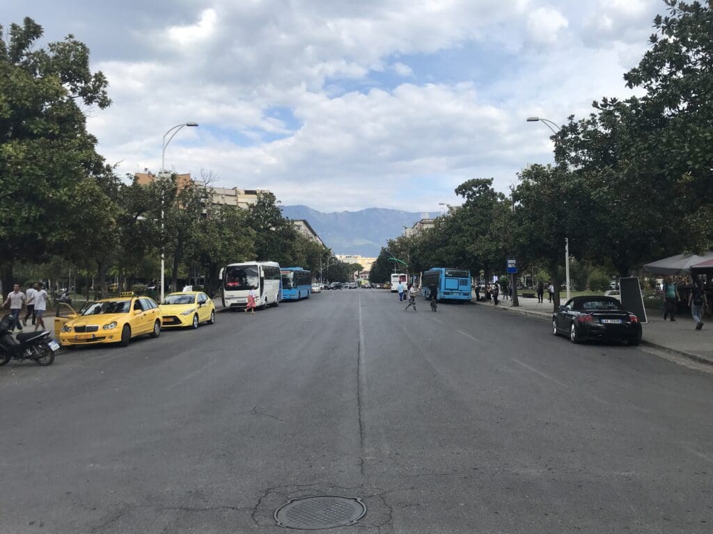 a street with cars and people on it