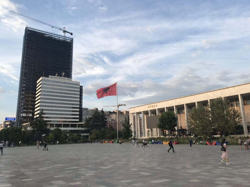 Skanderberg square with a flag in the middle of it in Tirana, Albania