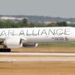 a large white airplane on a runway