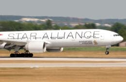 a large white airplane on a runway