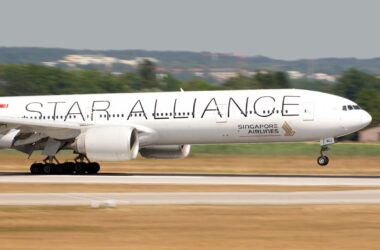 a large white airplane on a runway