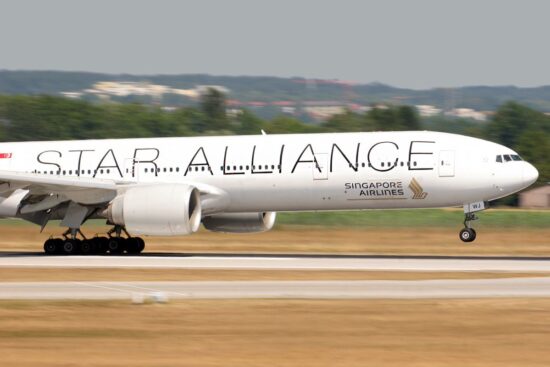 a large white airplane on a runway