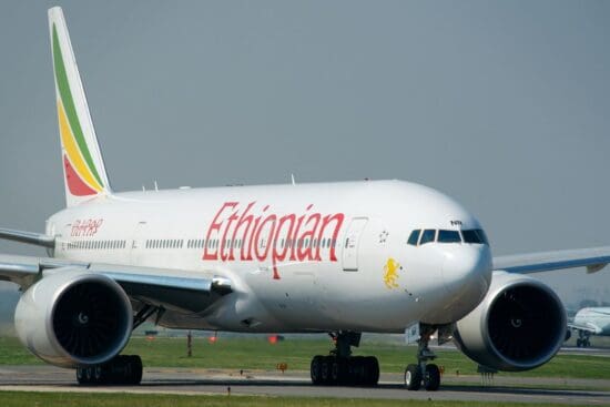 a large white airplane on a runway