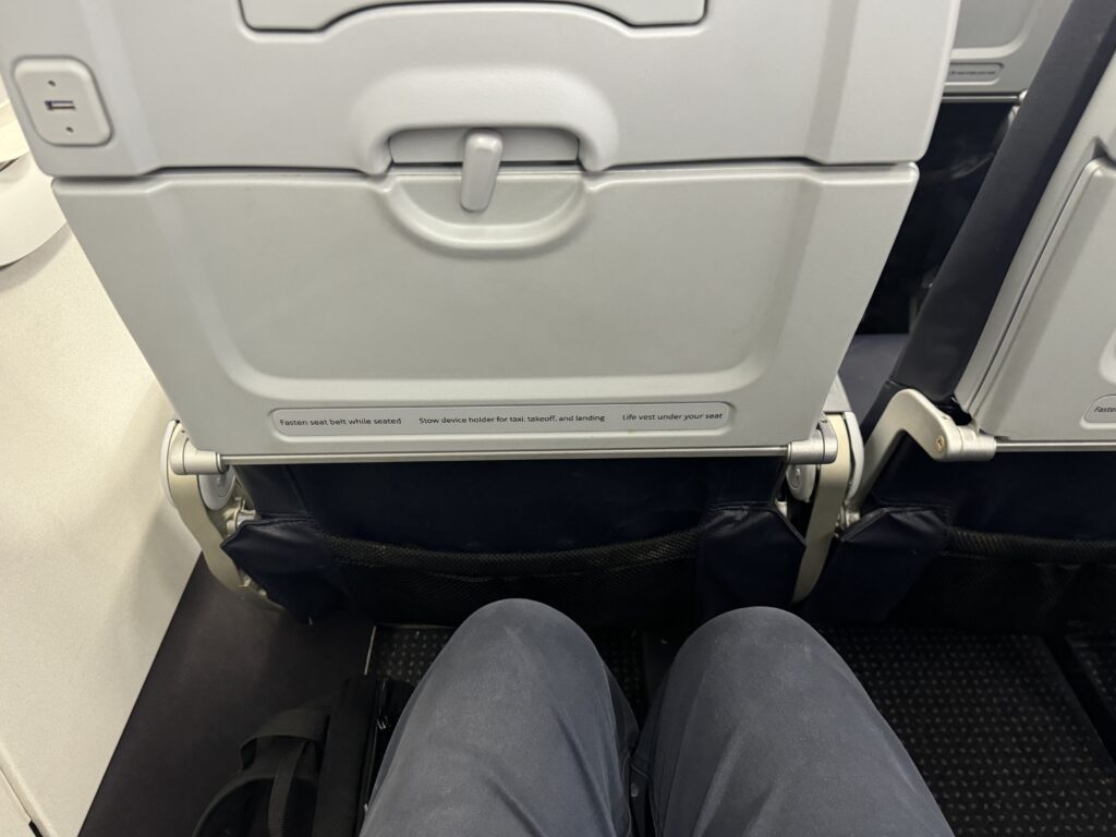 a person's legs in a seat