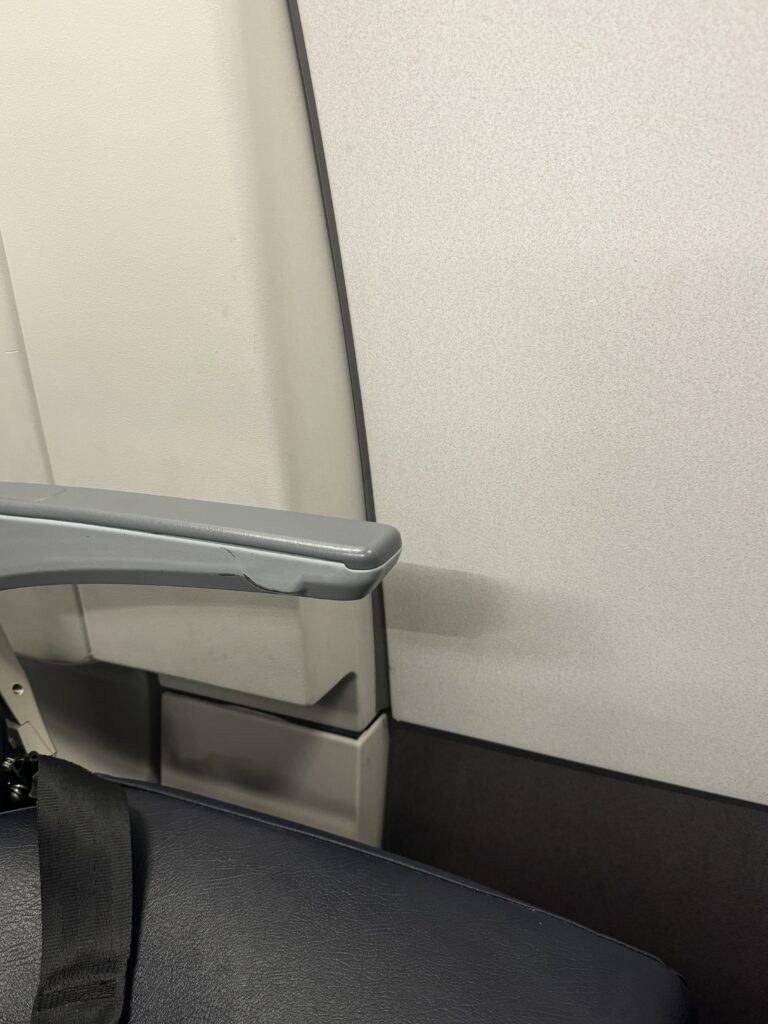 a grey arm rest on a chair