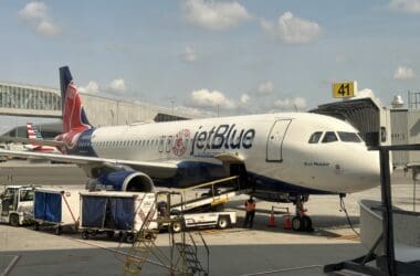 a JetBlue plane parked at an airport